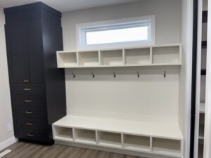 Cozy closet with bench and shelves | The Paint Masters