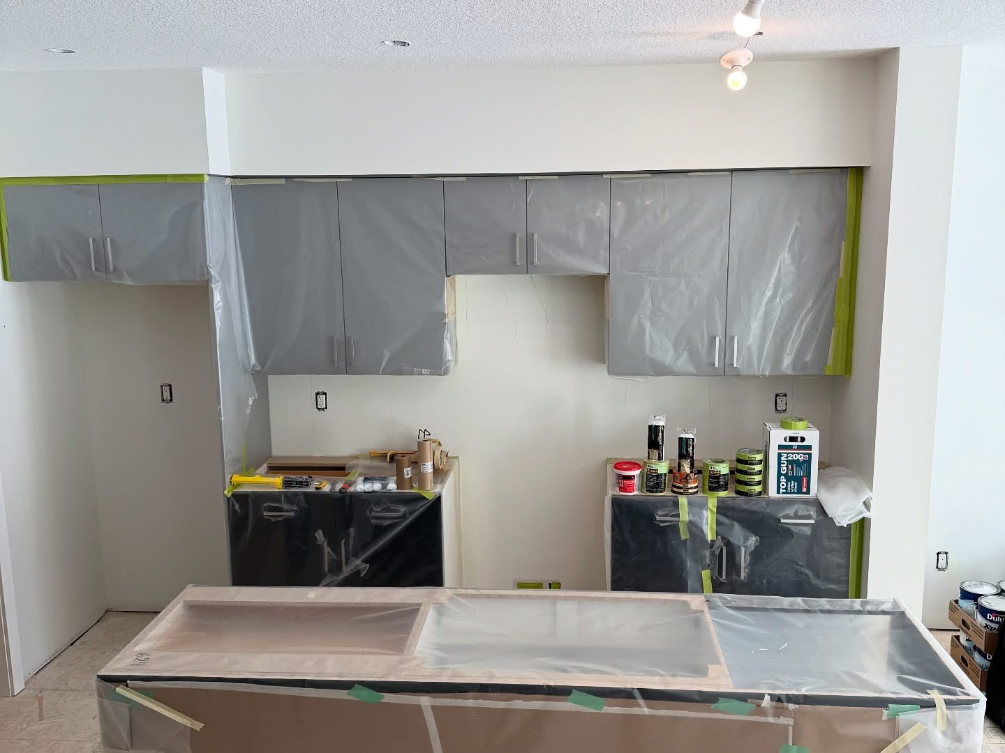 Kitchen cabinets being painted | The Paint Masters