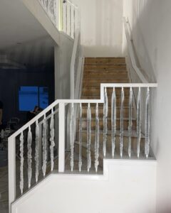 Minimalist white stair railing | The Paint Masters
