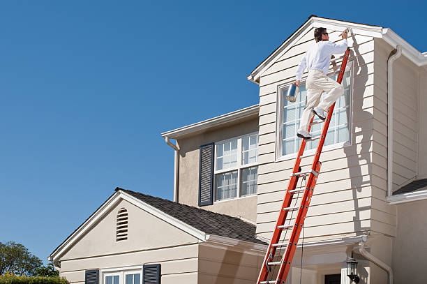 Man painting house exterior | The Paint Masters