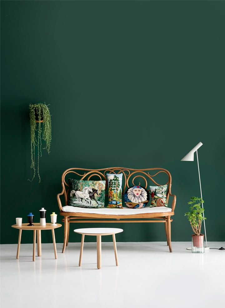Green living room with wicker couch | The Paint Masters